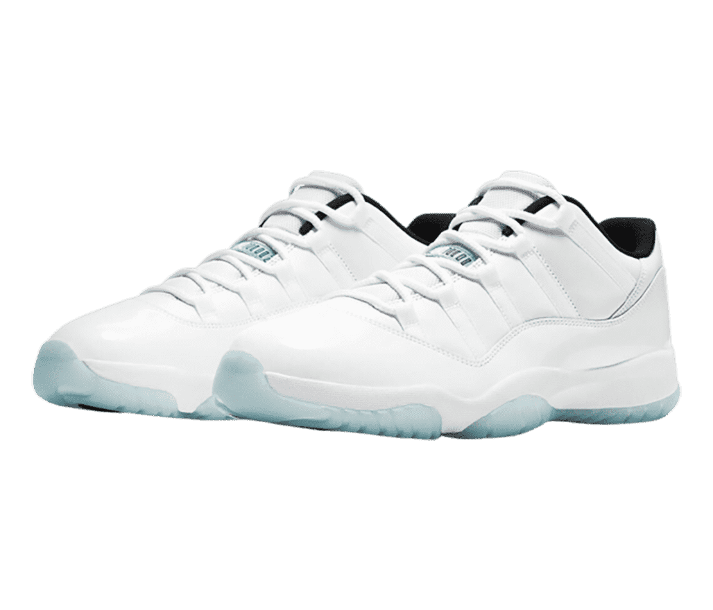 A white pair of AJ11 sneakers with patent leather overlays and light blue semi-translucent outsoles.