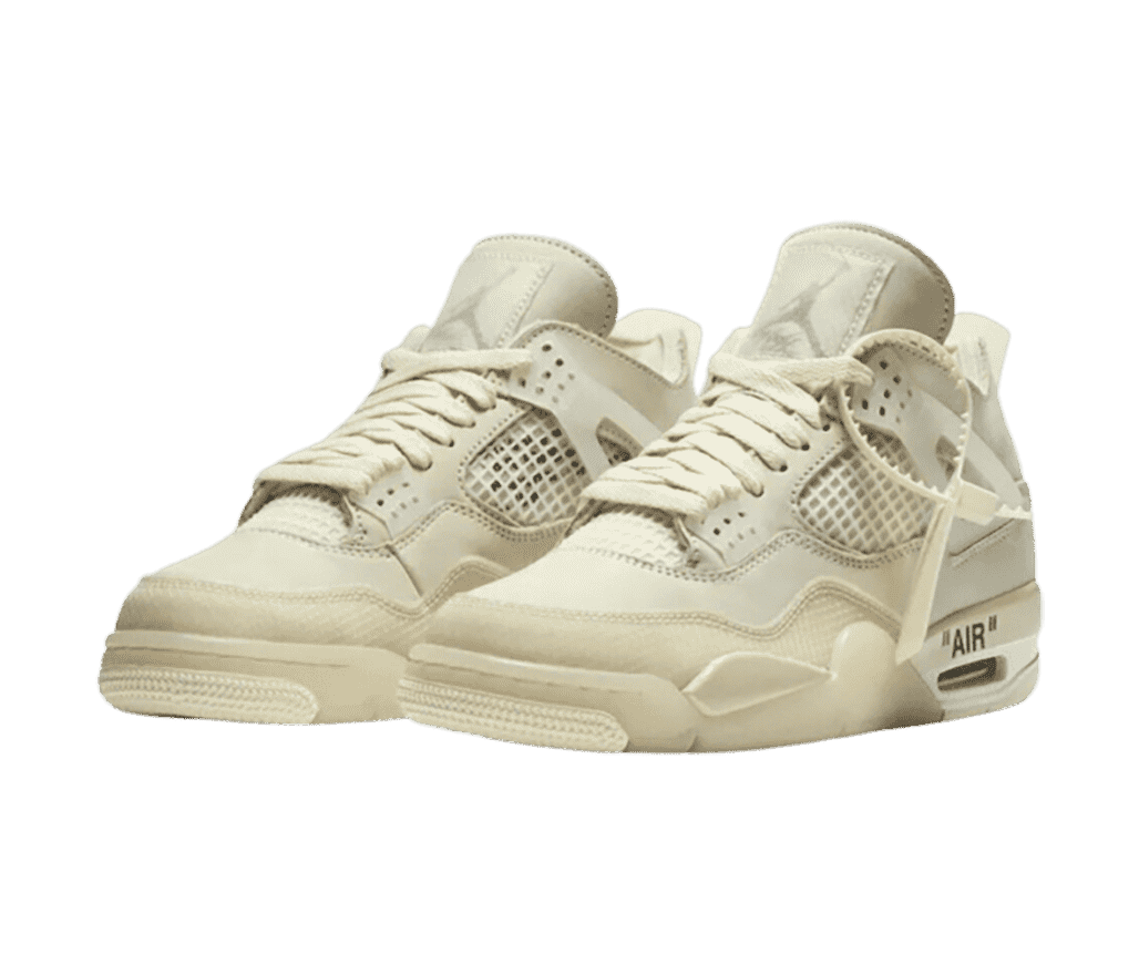 A pair of Jordan 4 in off-white have an almost light beige tone. They are high-tops with 'AIR' written in black on the sole.