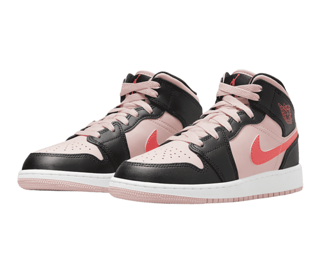 A light pink pair of AJ1 Mid sneakers with black overlays and hot pink Swooshes.