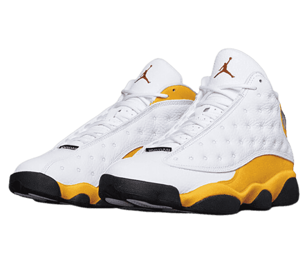 A white pair of AJ13 sneakers with gold suede midsoles and collars and black outsoles.