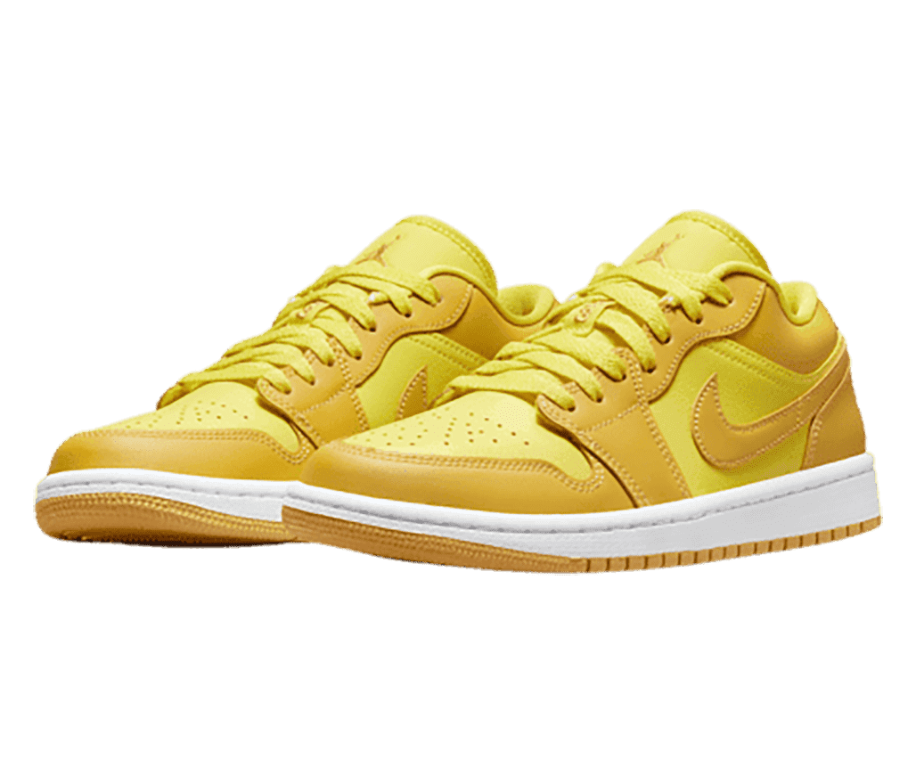 A two-toned yellow pair of AJ1 Low sneakers with white midsoles.