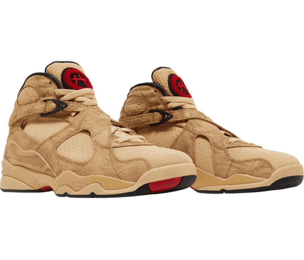 A sand colored suede pair of Rui Hachimura x AJ8 sneakers with red accents and lace straps.