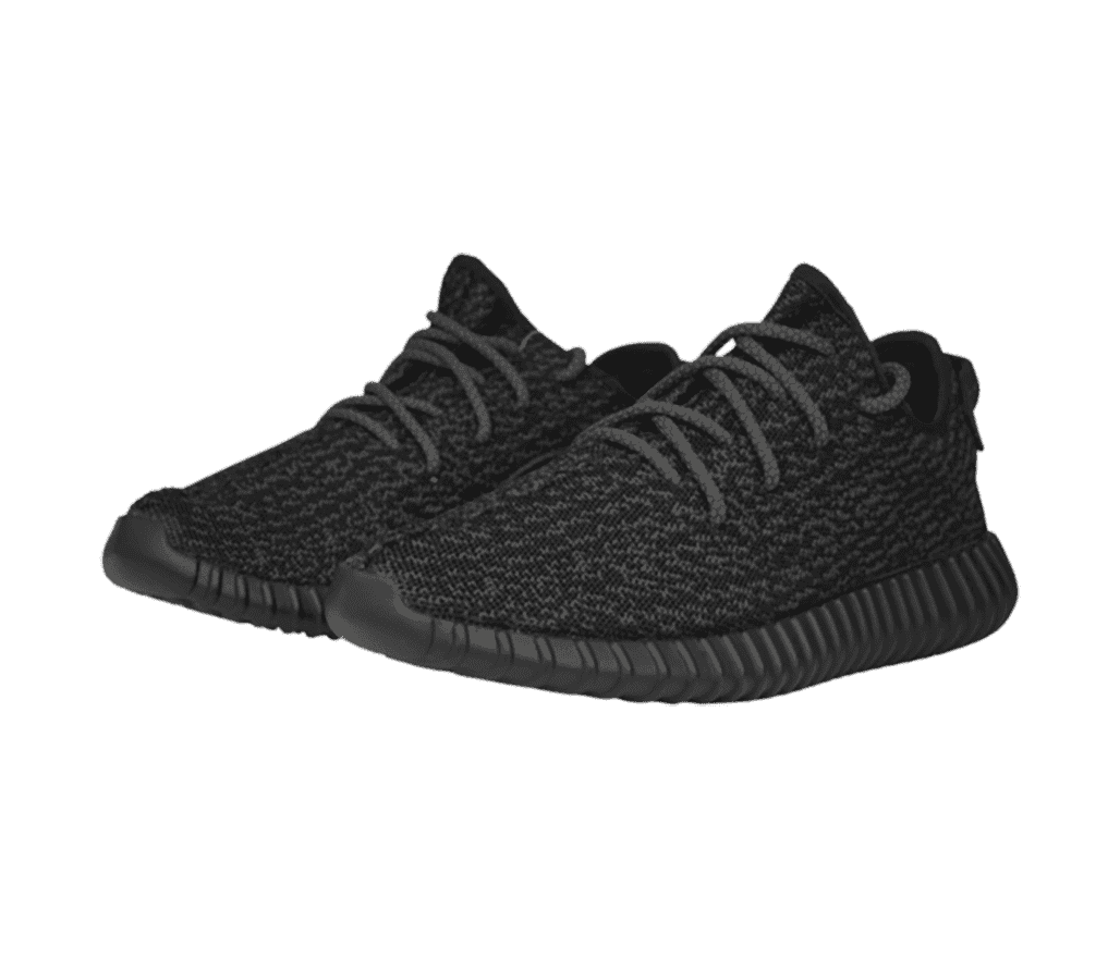 A pair of Adidas Yeezy Boost 350 V1 sneakers in a dark gray and black marled uppers and rope laces.