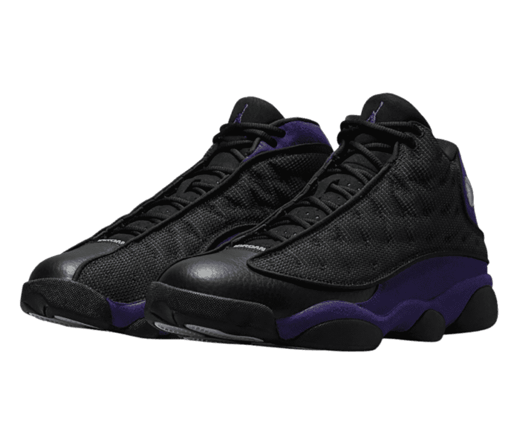 A pair of AJ13 “Court Purple” sneakers with purple quarters, black leather toeboxes, and black fabric vamps.