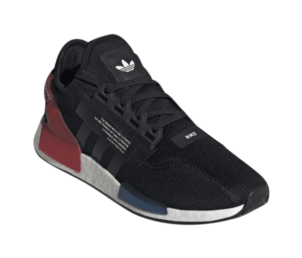 A black adidas shoe with a white sole. The black adidas stripes on the side are covered by a horizontal rectangular patch. The soles of the shoe have a blue accent near the front, and a red accent near the back that stretches up the heel.