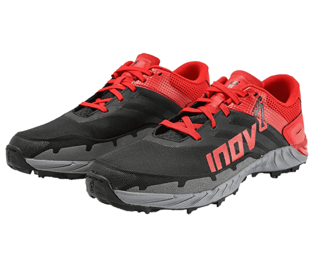 A pair of inov-8 Oroc Ultra 290 sneakers with a black front portion, red backside and lining, red laces, and a gray midsole. The inov-8 logo is on the lateral side with inversed colours.