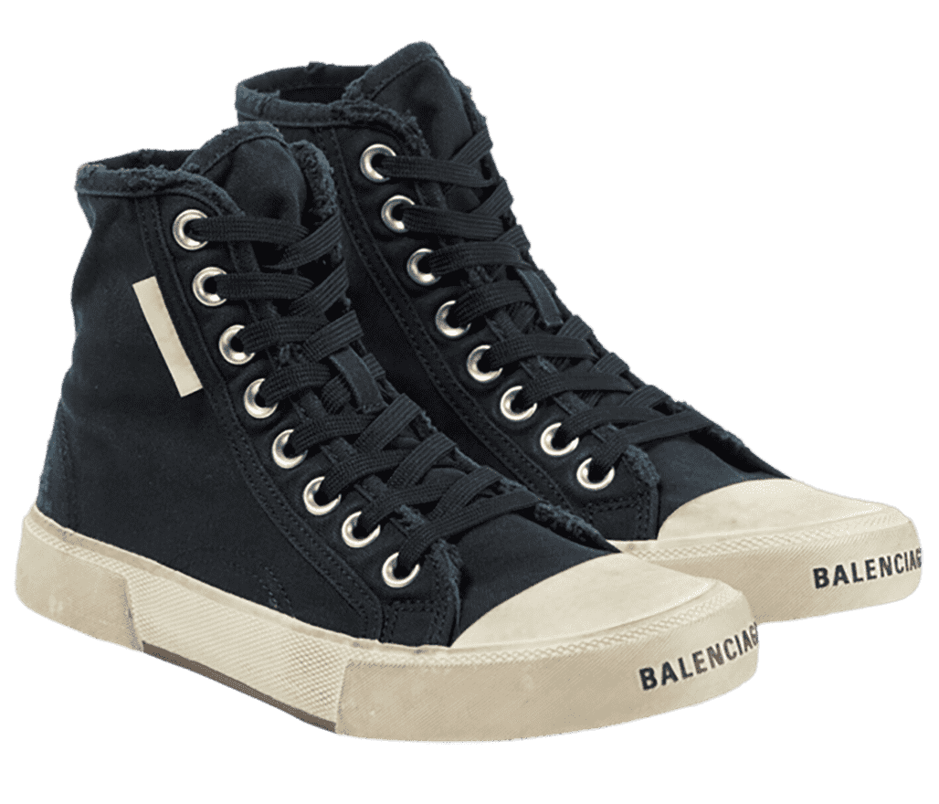 A pair of Balenciaga High-Top Paris sneakers in navy, a scuffed white sole and toebox, and black laces going all the way up eight pairs of chrome eyelets. The collars are distressed and the Balenciaga wordmark is at the front of the toe.