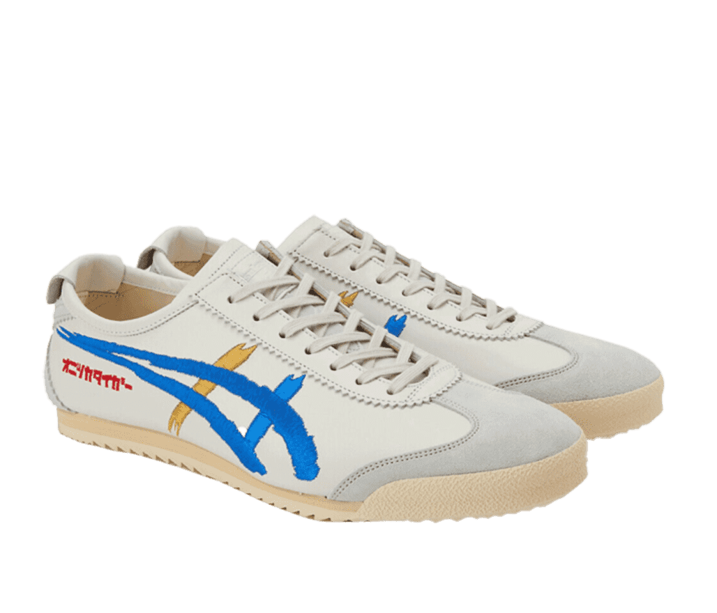 A pair of white and gray Onitsuka Tiger shoes with cream soles. The side of the shoe features a blue and yellow design.