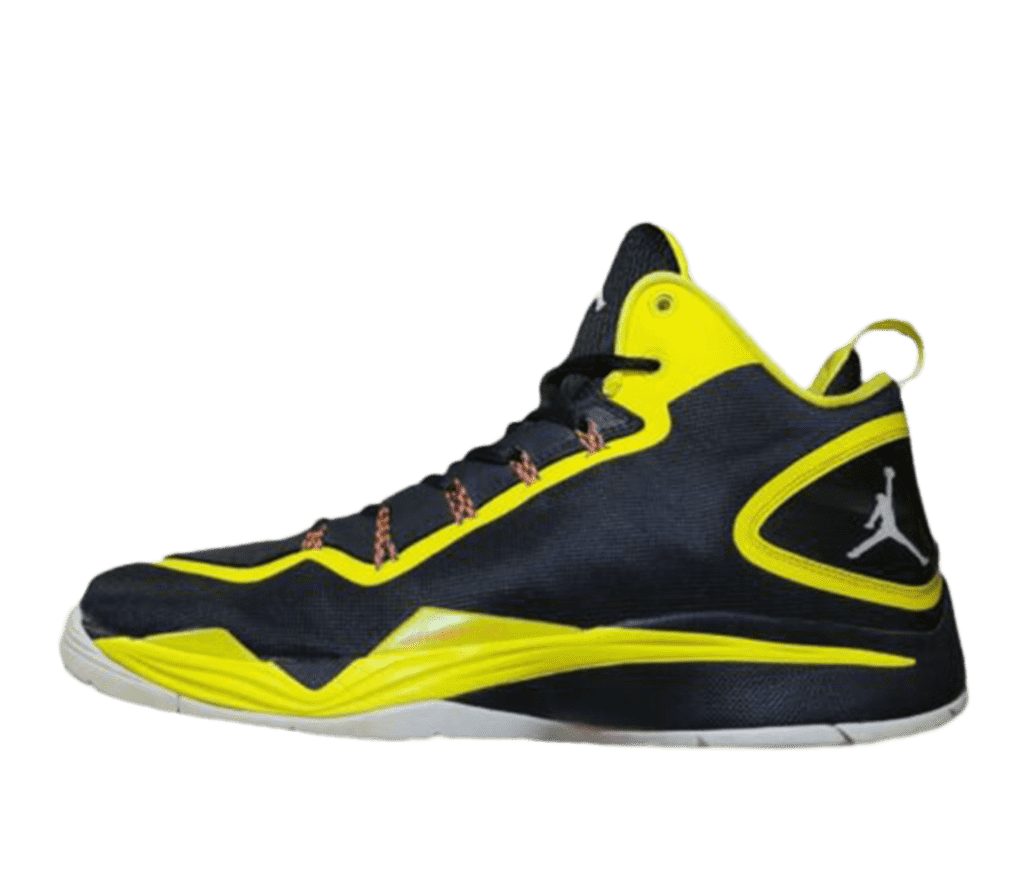 Side view of a Nike Jordan Super Fly 2. The shoe is mostly black with bright yellow sections zig-zagging across the shoe, calling to mind a lightning strike. On the heel is a gray Jumpman logo between the yellow lines.