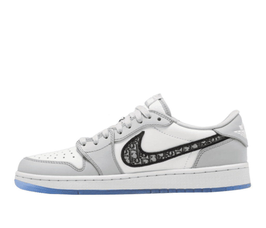 Side view of a Nike x Dior Air Jordan 1 low. The shoe is primarily white with gray overlays, with a blue bottom on the sole. The Nike swoosh logo is outlined in black thread and filled with the Dior monogram in gray tones.