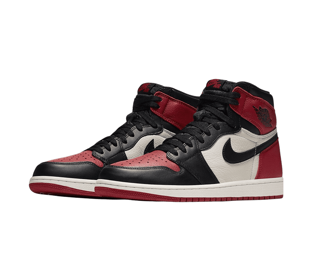 A pair of AJ1 High sneakers in black leather tips, heels, and vamps, red toeboxes, outsoles, and heels, and white midsoles and quarters.