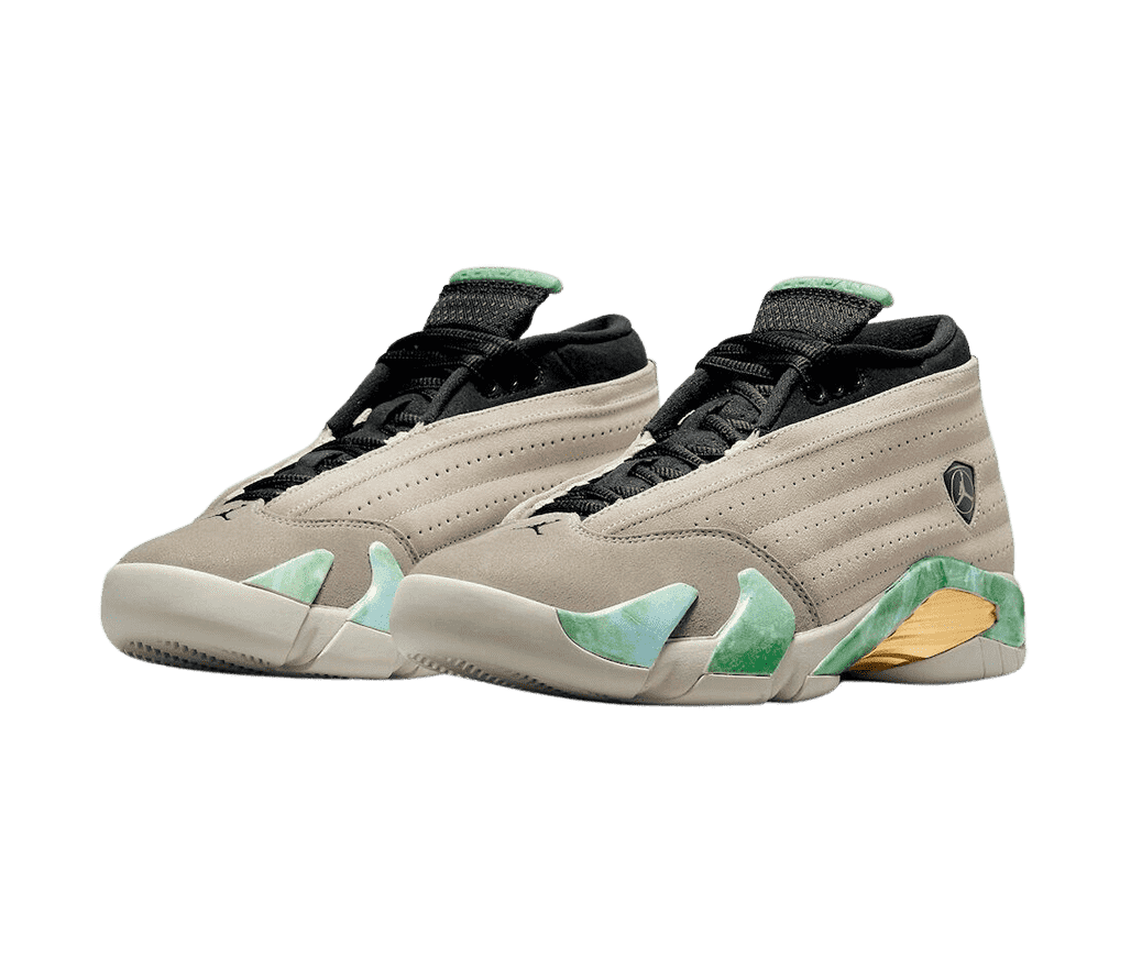 A pair of Aleali May x AJ14 Low sneakers in two shades of beige uppers, green and white marbled sole panels, and black tongue and laces.