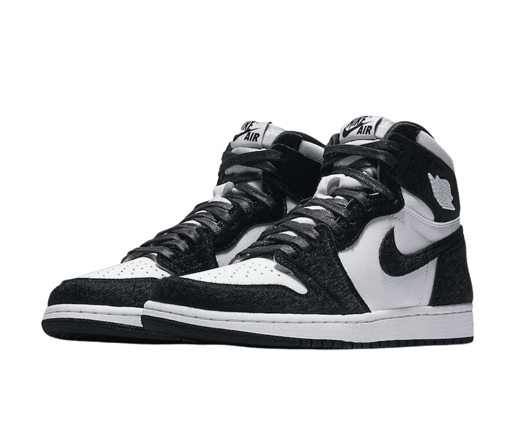 A pair of AJ1 High “Twist” sneakers in white tumbled leather uppers with black pony hair panels and Swooshes.