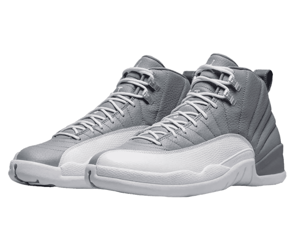 A gray leather pair of AJ12 Retro sneakers with white mudguards, soles, a laces, and metallic lace locks.