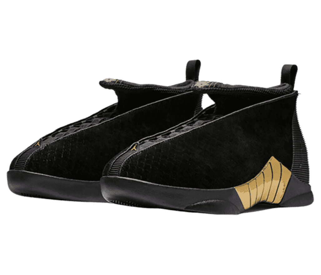 A pair of black AJ15 “Doernbecher” in patterned polyster uppers with a high collar and winged tongue that’s curled out toward the toe. The sheos have black rubber soles with a section of gold plastic strips in the middle.