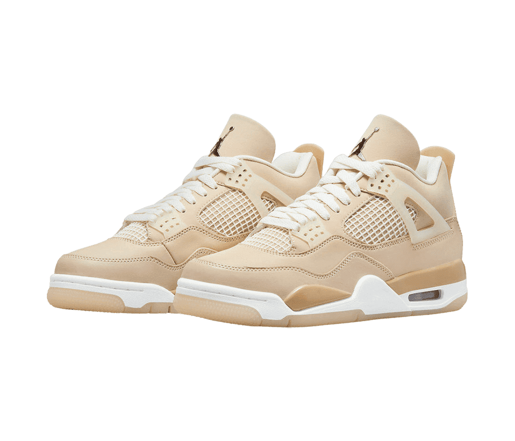 A cream pair of AJ4 sneakers in suede, white plastic netted sections on the sides and lower tongue, lace cages, and beige, white, and gum soles.