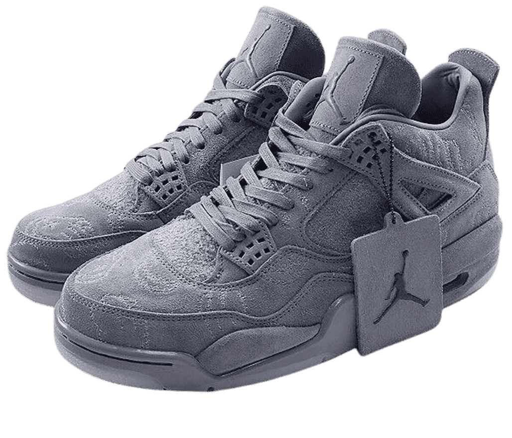 A pair of KAWS x AJ4 “Cool Grey” sneakers in all-gray suede, subtle stitched-on patterns covering the shoes, and a gray suede Jordan tag with a black logo hanging off the left shoe.