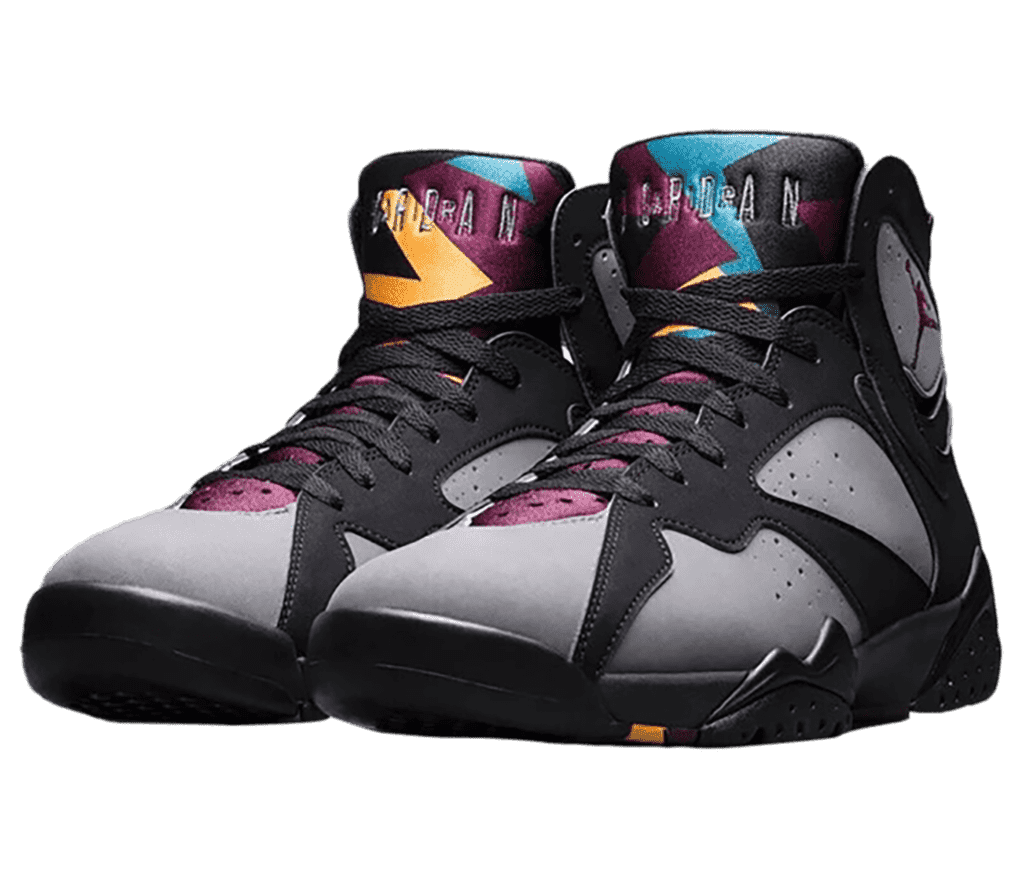 A black and gray pair of AJ7 “Bordeaux” sneakers in suede. They have purple tongues with jagged orange and blue accents on the top, surrounding the “Air Jordan” logotype.