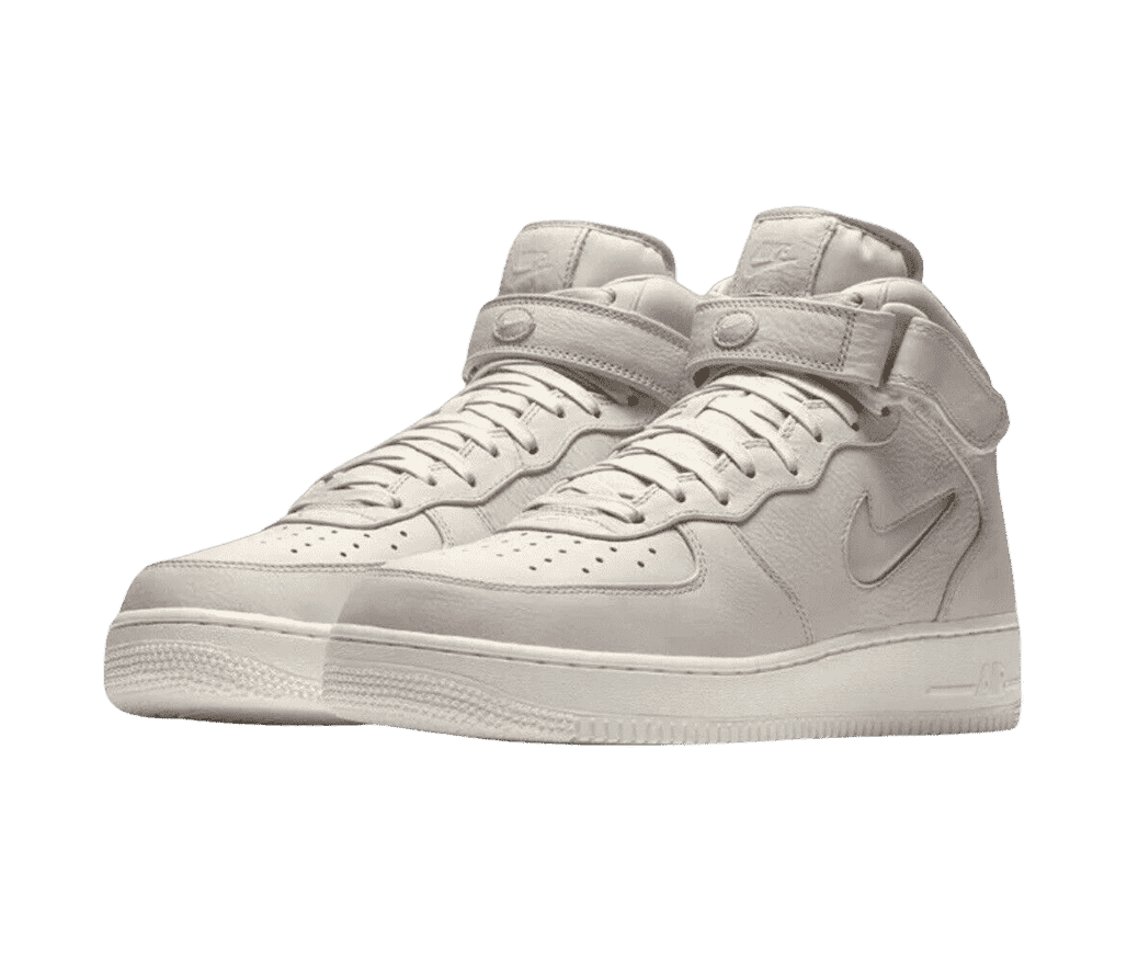 A pair of Nike AF1 Mid “Jewel” sneakers in an off-white tumbled leather.