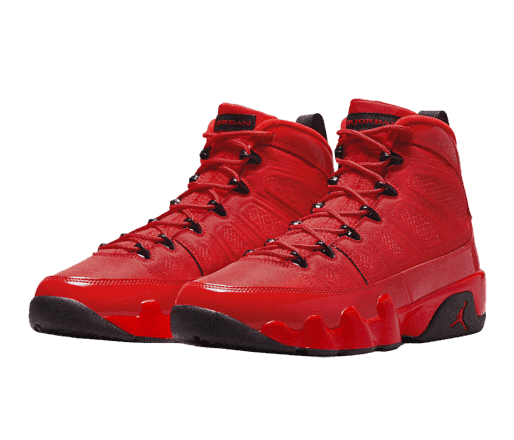 A pair of AJ9 Retro Chile Red sneakers with a padded upper and black outsoles, eyelets, branding on the tongue, and straps at the heeltab.