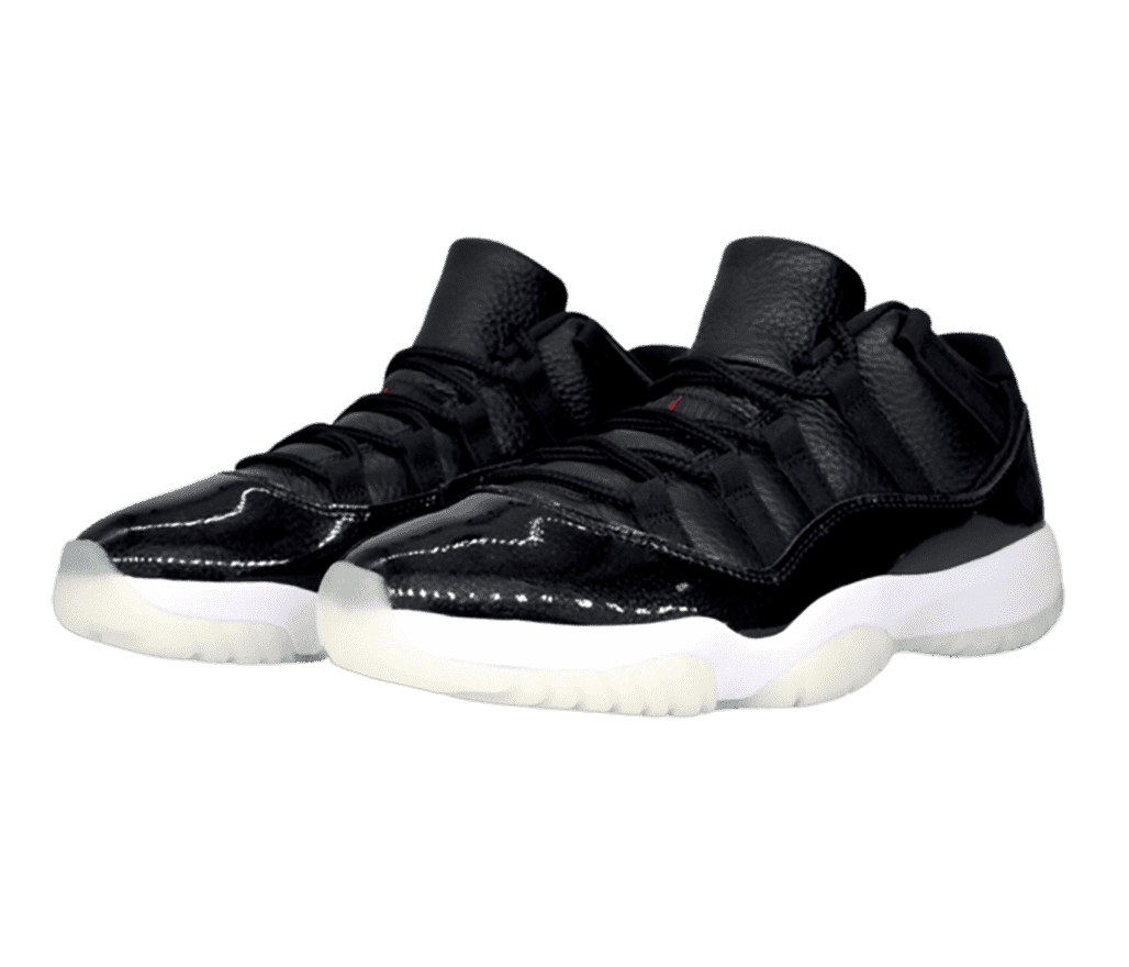 A black pair of AJ11 in tumbled leather, patent overlays, white midsoles, and off-white semi-translucent outsoles.