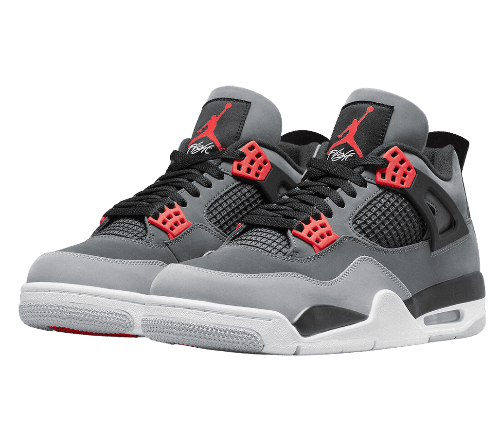 A suede pair of AJ4 “Royalty” sneakers in two shades of gray with red lace cages and logos on the tongue and black and white soles.