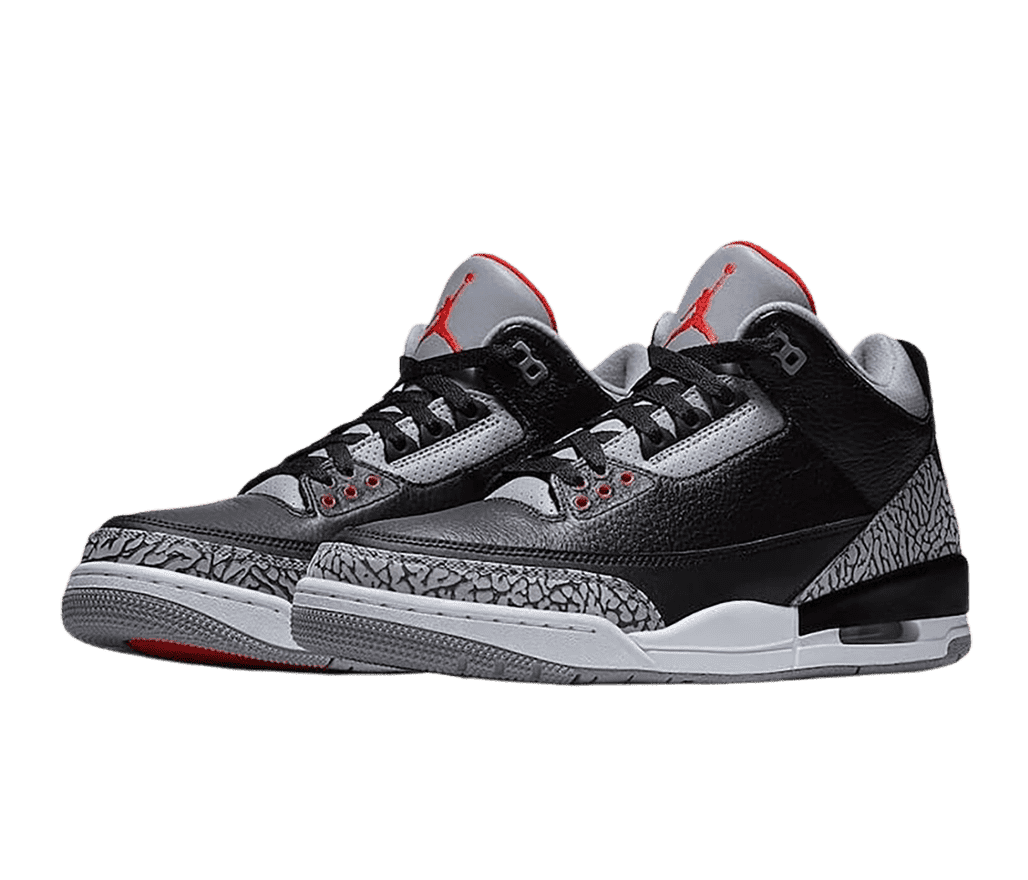 A pair of black AJ3 sneakers with light gray elephant print tips and heels, light gray midsoles, a darker gray outsole and tongue, and a red Jordan logo.