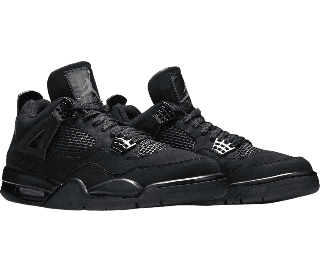 A all-black pair of AJ4 “Black Cat” Retro sneakers in suede, white netted sections on the sides and lower tongue, lace cages, and leather outsoles.