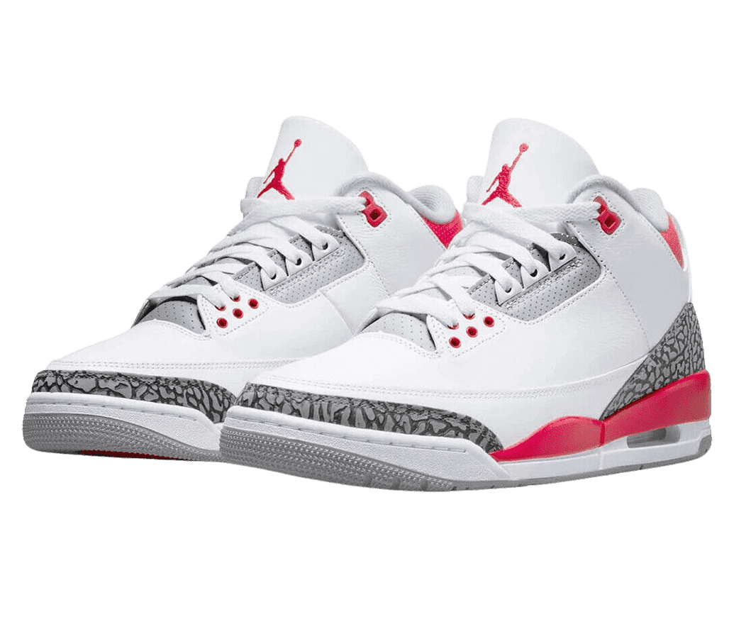 A pair of white AJ3 sneakers with red accents around the sole and collar, a gray outsole, and light gray elephant print tips and heels.