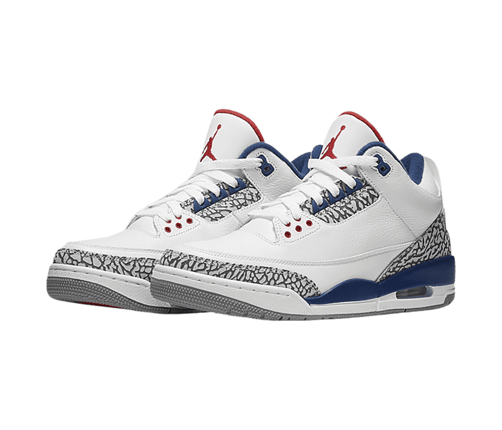A pair of white AJ3 “True Blue” sneakers with dark blue accents around the sole and collar, a gray outsole, and light gray elephant print tips and heels.