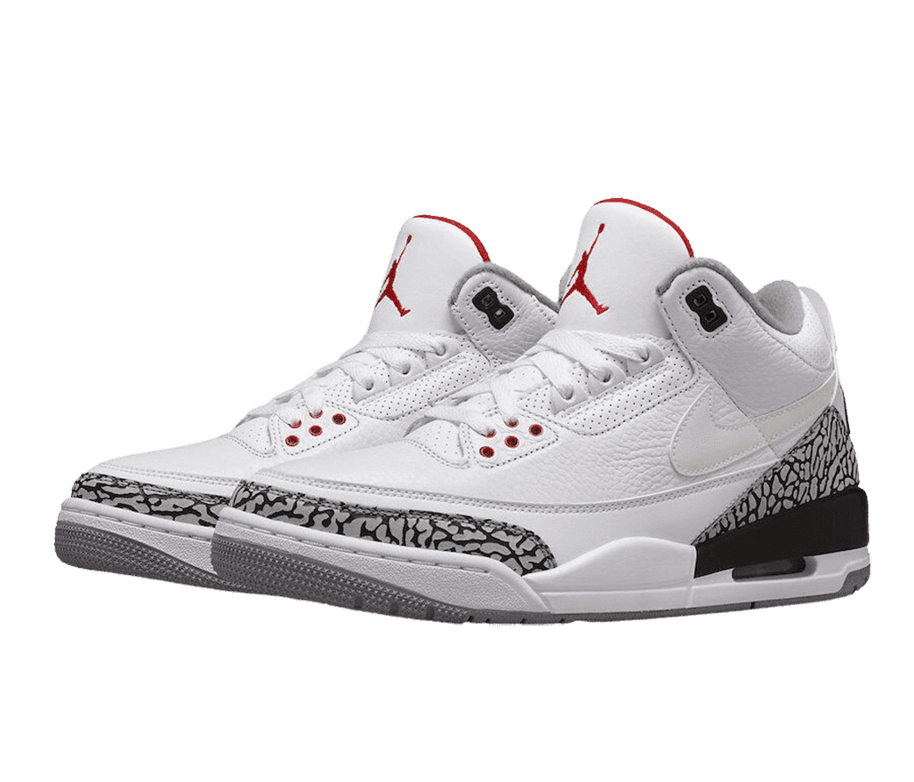 A pair of AJ3 “Cement” sneakers with gray and black elephant print tips and heels, white midsoles, a darker gray outsole, and a red Jordan logo.