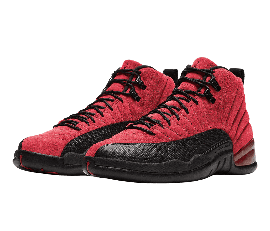 A pair of AJ12 “Reverse Flu Game” sneakers in a red suede, black rubber soles and mudguards, and shiny black lace locks.