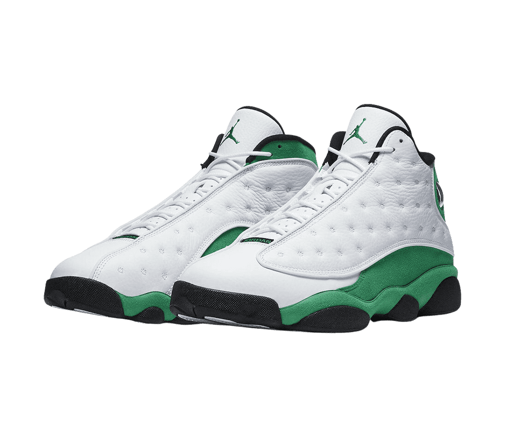 A white pair of AJ13 “Lucky Green” sneakers in leather uppers and vamps, black outsoles, and green suede quarters and midsoles.