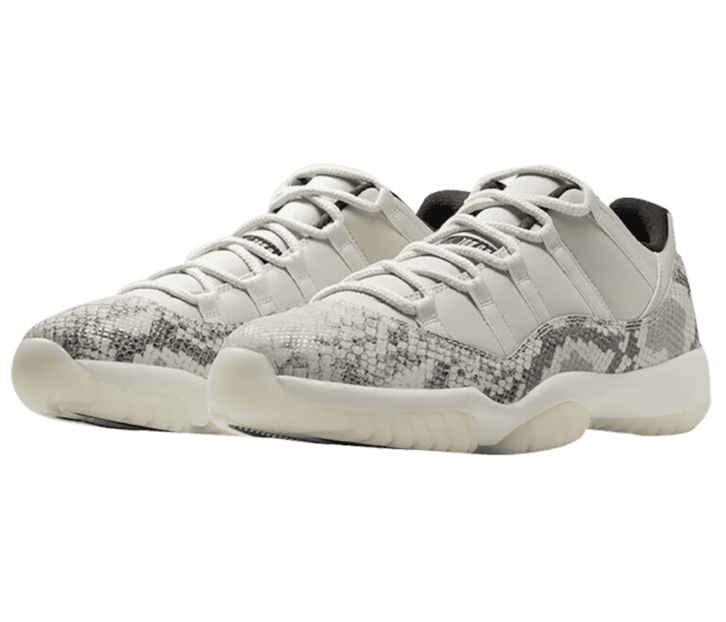 An off-white pair of AJ11 “Snakeskin” sneakers with bone gray snakeskin overylays.