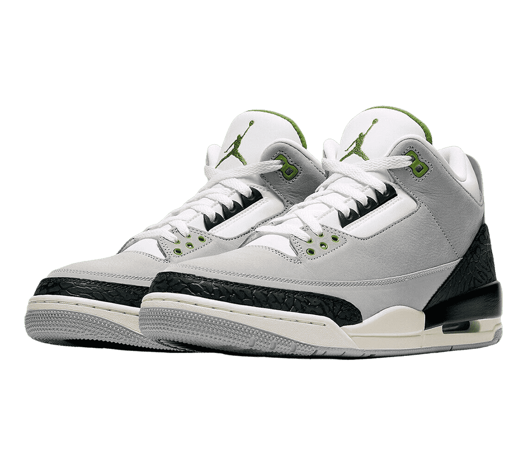 A gray suede pair of AJ3 “Chloropyll” sneakers with gray outsoles, white tongues, black-on-black elephant print tips and heels, cream midsoles, and an olive green Jordan logo.