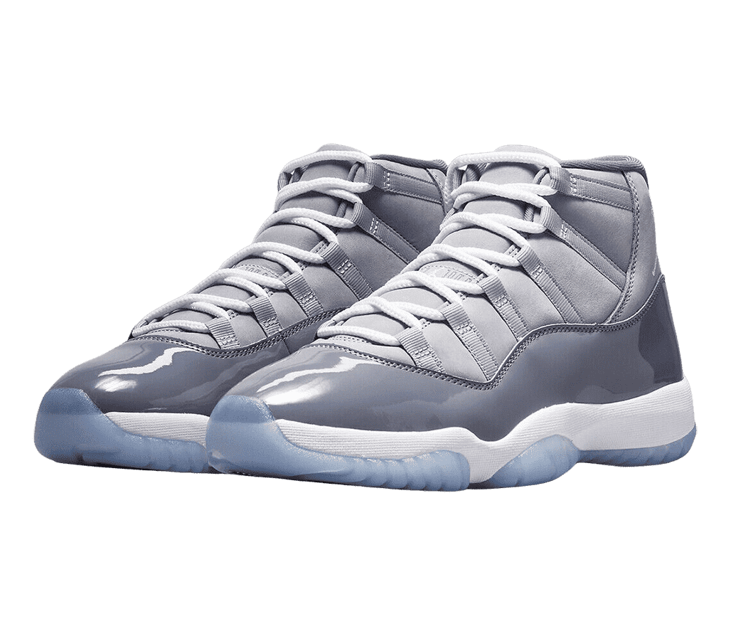 A pair of AJ11 “Cool Grey” sneakers in two shades of gray uppers, white laces and midsoles, and blue translucent outsoles.