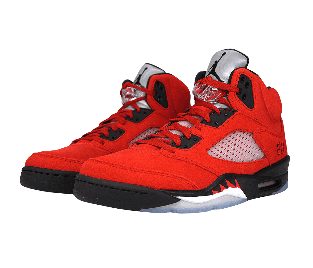 A pair of AJ5 “Raging Bull” sneakers in red suede, black soles, a clear lace lock, metallic tongues with a black Jordan logo, and translucent perforated plastic in the midsections.