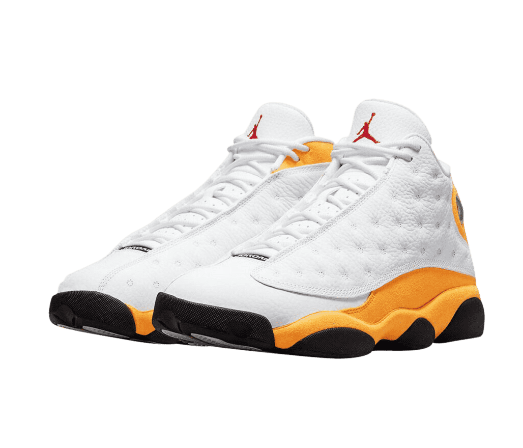 A white pair of AJ13 “Del Sol” sneakers with bright yellow quarters and midsoles, black outsoles, and a red Jordan logo.