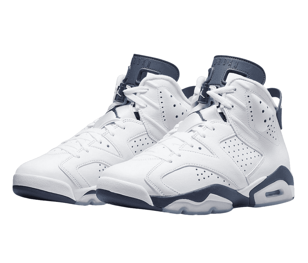 A white pair of AJ6 “Midnight Navy” Retro sneakers with midnight navy tongues, midsoles, lace toggles, and heel pulls.