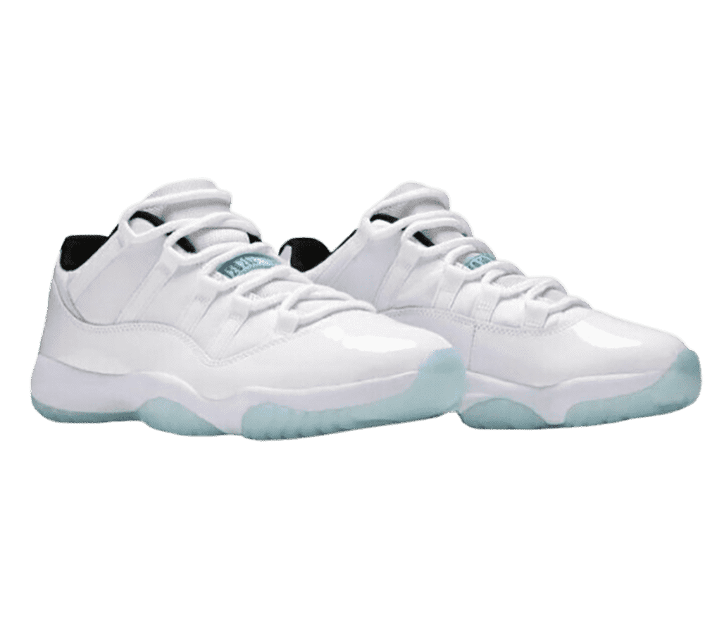 A white pair of AJ11 “Legend Blue” sneakers with blue translucent outsoles, and patent leather quarters and toeboxes.