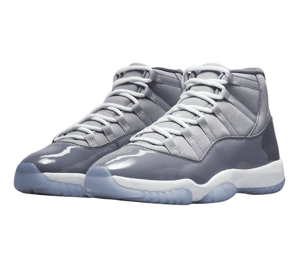 A pair of AJ11 “Cool Grey” sneakers in two shades of gray uppers, white laces and midsoles, and blue translucent outsoles.