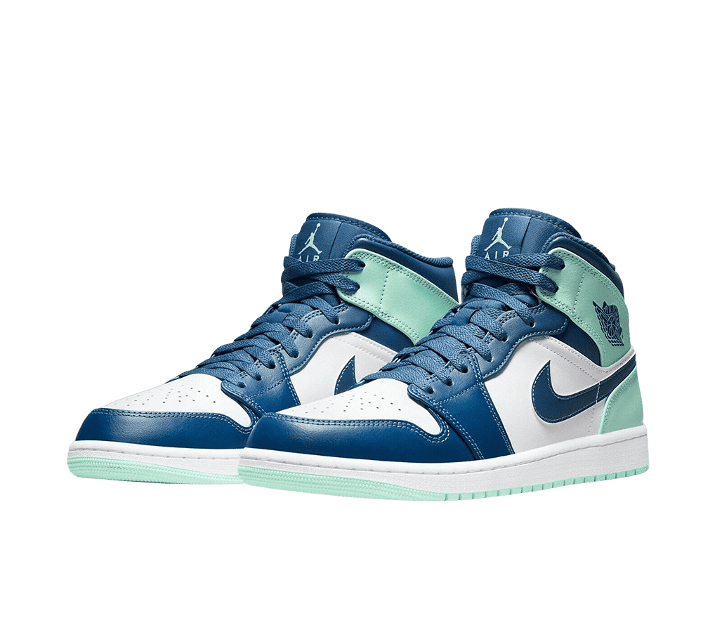 A pair of AJ1 “Blue Mint” sneakers with navy tips, laces, and tongues, white toeboxes and quarters, and mint heels and outsoles.