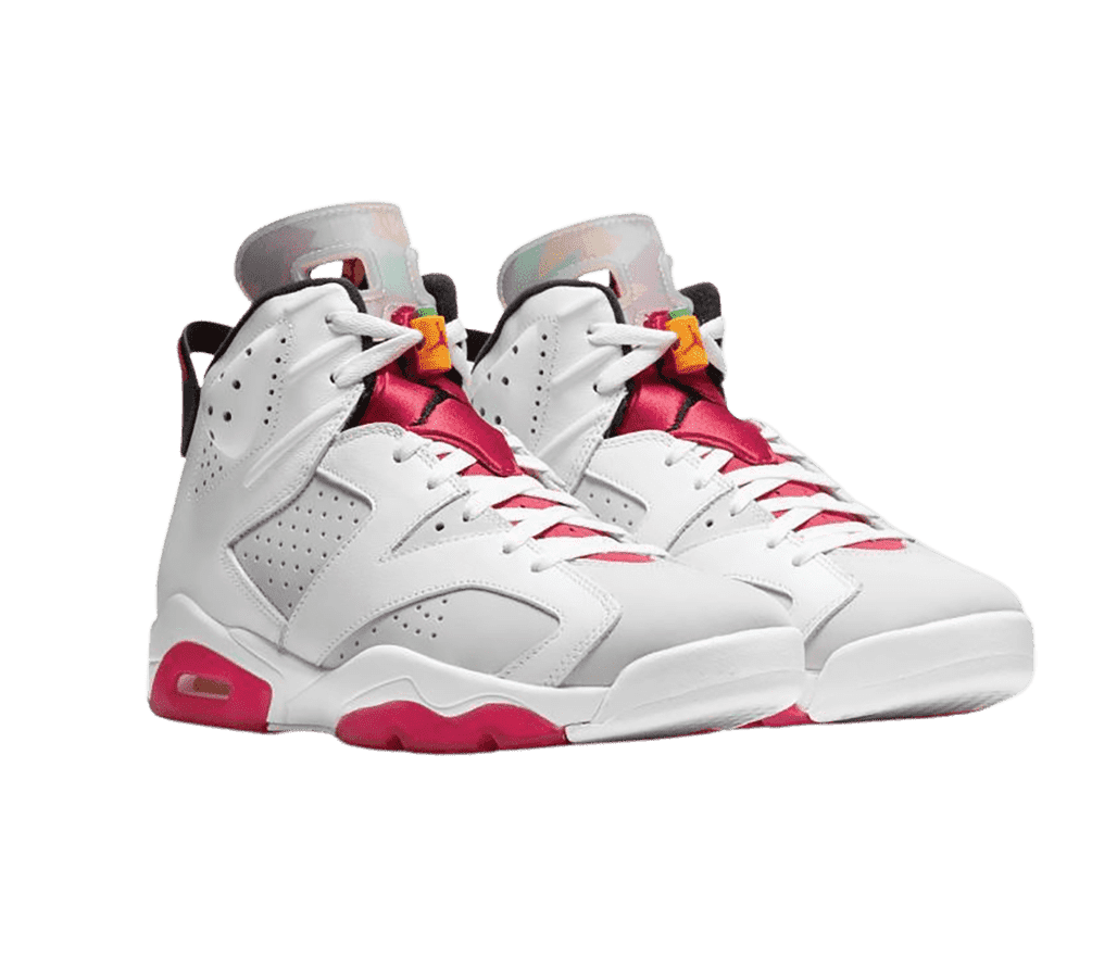 A white pair of AJ6 “Hare” sneakers with red accents on the soles, red fabric tongues, and orange lace locks.