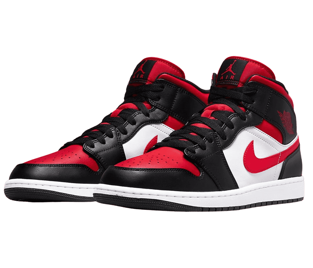 A pair of AJ1 “Bred Toe” sneakers with red toeboxes, Nike Swoosh marks, and tongues, white quarters and midsoles, and black tips, laces, heels, and outsoles.