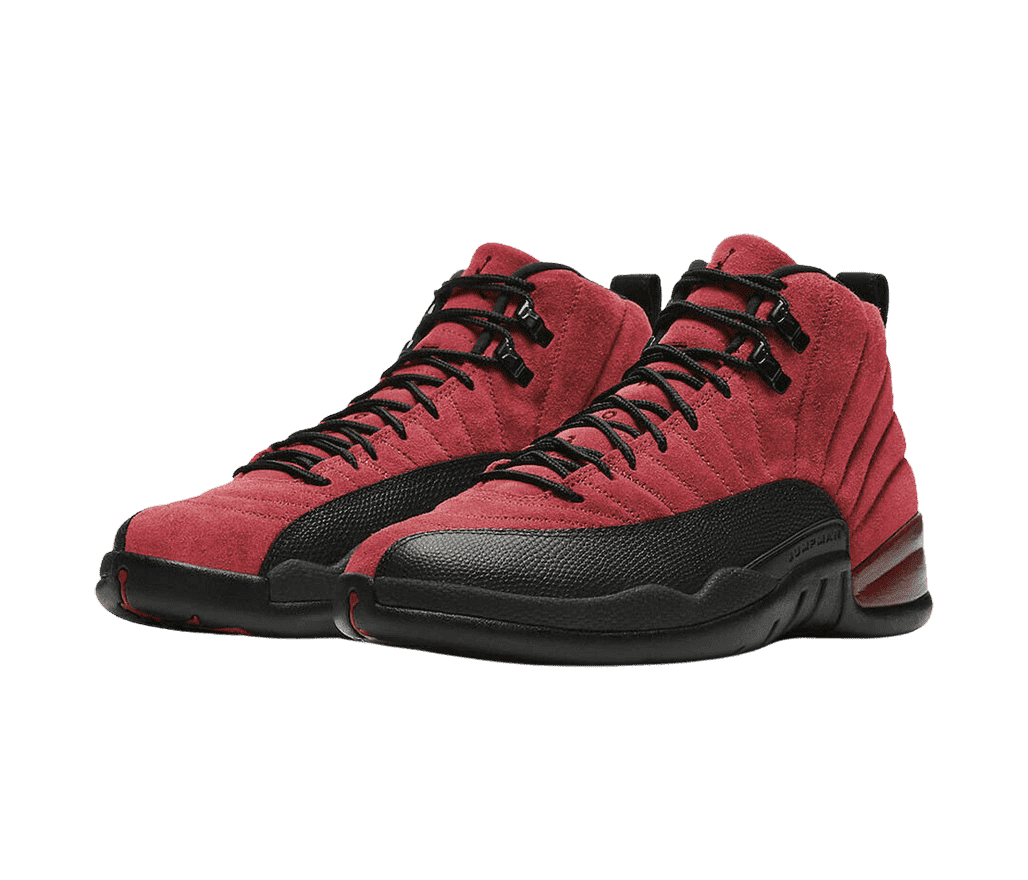 A pair of AJ12 “Barcelona” sneakers in a deep red suede, black rubber soles and mudguards, and shiny black lace locks.