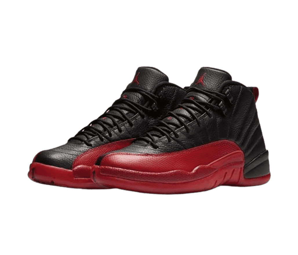 A black pair of AJ12 “Flu Game” sneakers with leather uppers and red snakeskin mudguards.