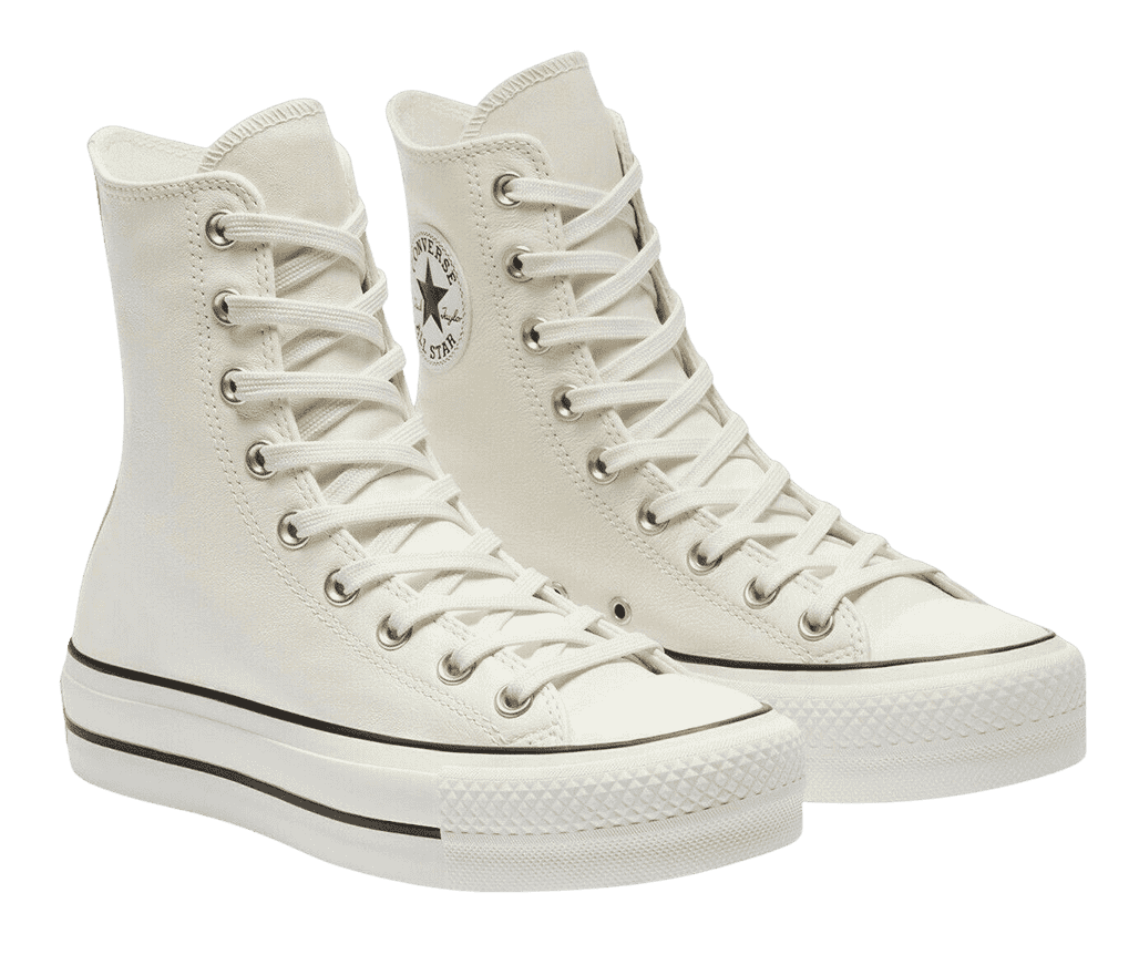 A extra-high pair of Converse Chuck 70 sneakers in a creamy white leather and white soles with black outlines.