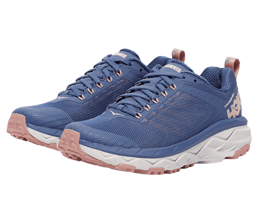 A pair of Hoka Challenger ATR 6 sneakeres in blue mesh, white midsoles, and salmon outsoles and heel pulls.