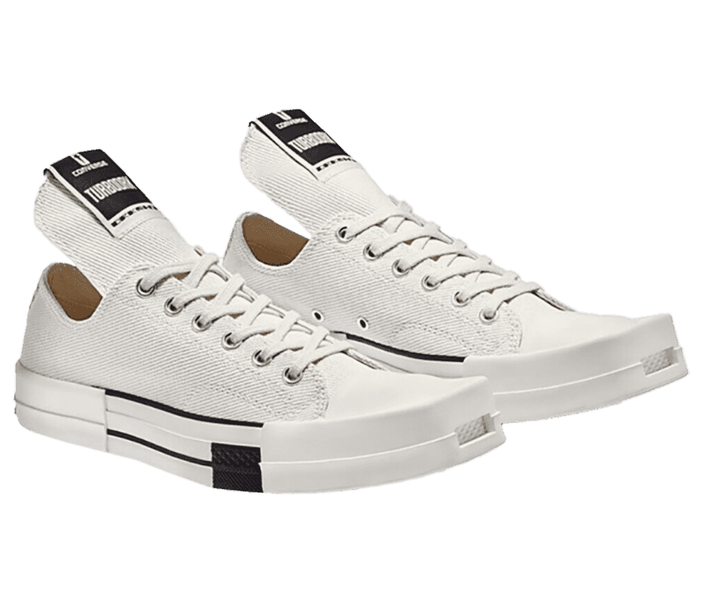 A creamy white pair of Rick Owens x Converse DRKSHDW sneakers with rubber square winged tips and an elongated tongue pull with a black tag.