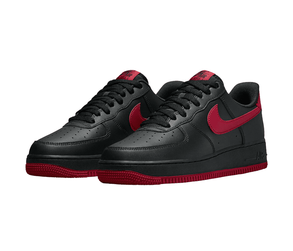 A black leather pair of AF1 Low sneakers with dark red outsoles, tongue tags, and Nike Swoosh overlays.